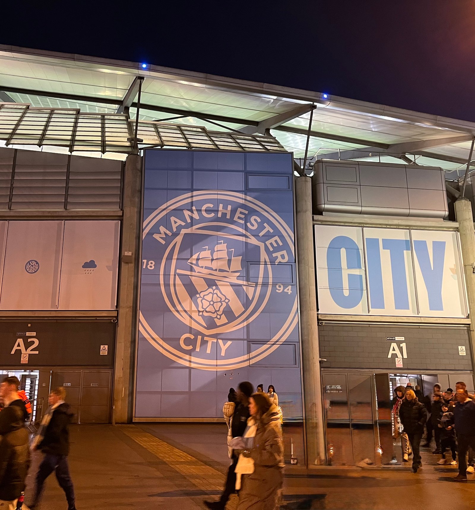 Etihad Stadium and Manchester City supporters on matchday